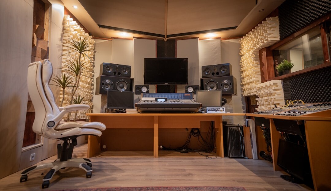 Team of audio engineers collaborating in a studio control room