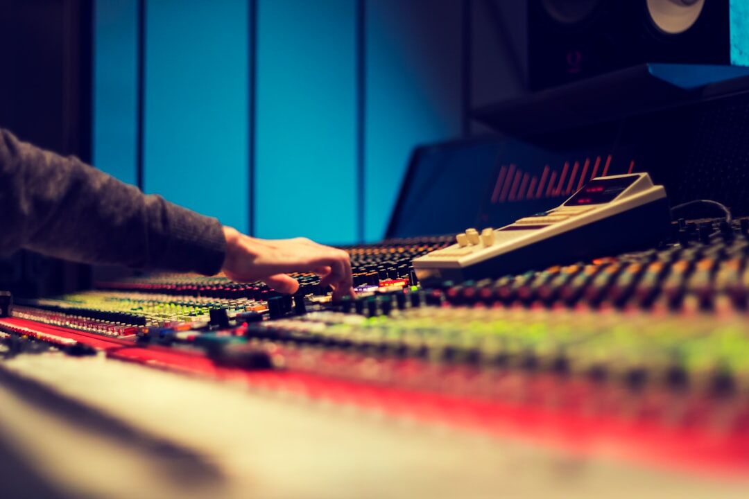 Audio engineer working at mixing console
