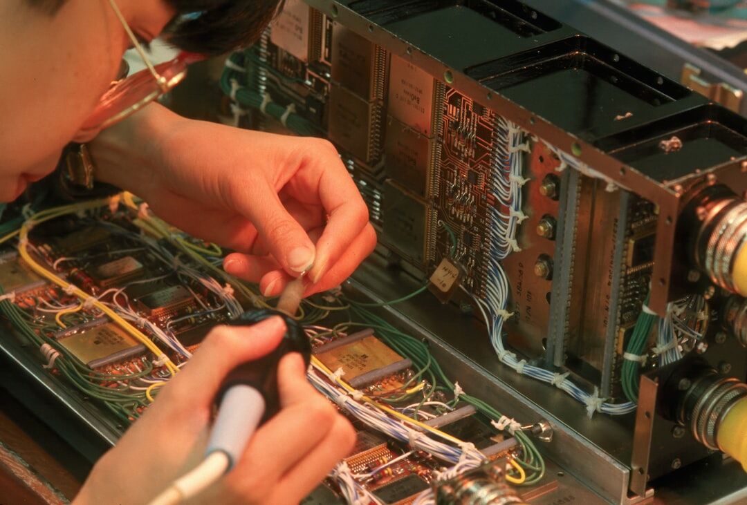 Technician troubleshooting broadcast equipment